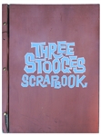 Moe Howard's ''Three Stooges Scrapbook'' & 2 Photos of the Stooges Holding Up one of the Scrapbooks on Their Show -- 17.5'' x 24.5'' Empty Book Has Moe's Name Stamped at Lower Right -- Damage to Spine
